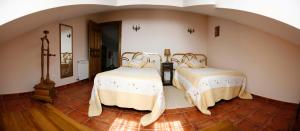 Posteľ alebo postele v izbe v ubytovaní Casa El Artesano
