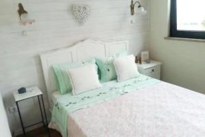 Un pat sau paturi într-o cameră la Casa da Ponte