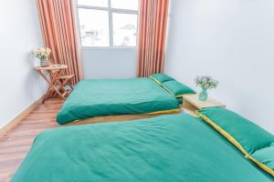Postel nebo postele na pokoji v ubytování CSLTDL Địa Du