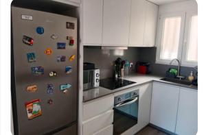 Kuchyň nebo kuchyňský kout v ubytování Apart Playa Bellreguard 1 habitación + 4 fotografie