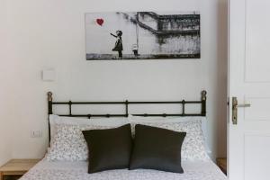 A bed or beds in a room at LA CASETTA Malpensa Guesthouse