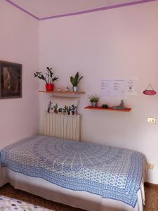 Posteľ alebo postele v izbe v ubytovaní A casa di Sara