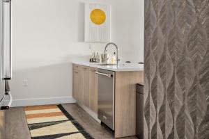 a kitchen with a sink and a counter at New! Sprawling Floor Plan - Central LoHi - Peloton in Denver