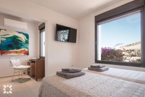 Televízia a/alebo spoločenská miestnosť v ubytovaní Villa Los Roques by Abahana Villas