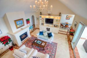 an overhead view of a living room with a chandelier at La Perla De La Bahia in Bahia de Casares