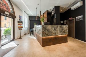 a lobby with a marble counter in a building at Hotel Astoria in Bologna