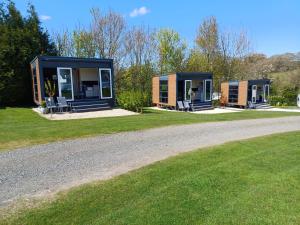 a tiny house on the side of a road at Luxury Pods at Mornest Caravan Park, Anglesey in Gaerwen