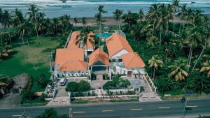 an aerial view of a house on the beach at Rejuvenate Resort and Restaurant in Jembrana