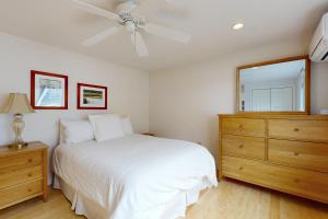 En eller flere senge i et værelse på Family Beach Retreat