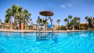 Bazén v ubytovaní Oasis Tamarindo alebo v jeho blízkosti