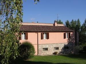 a large brick house with a roof at Il Borghetto in Todi