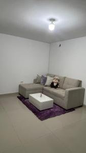 a living room with a couch and a coffee table at Apartamento festival vallenato in Valledupar