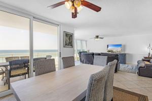 a dining room with a table and chairs at FL-Seaspray Perdido Key 605 condo in Pensacola