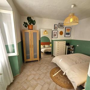 a bedroom with two beds and a dresser in it at Casa di Marco in Irola