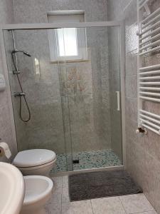 a bathroom with a shower and a toilet at A casa di nonna Lina in Polignano a Mare