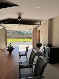 a kitchen with a table and chairs and a stove at Casa Bieiteiros in Valdoviño +27 photos