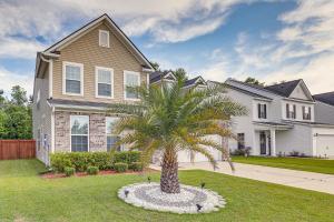 a palm tree in front of a house at Pet-Friendly Ladson Home 23 Mi to Charleston! in Ladson