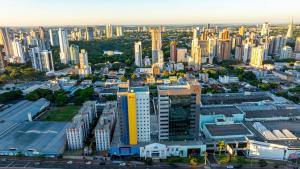 an aerial view of a city with tall buildings at HUS Hotel MARINGA in Maringá