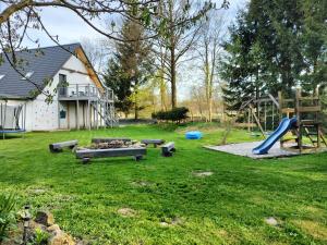 a park with a playground with a slide at Stara Kuźnia in Duszniki Zdrój