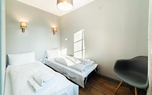 Ένα ή περισσότερα κρεβάτια σε δωμάτιο στο Apartamenty Good Time - Malownicze Osiedle Podgórze