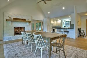 a kitchen and living room with a wooden table and chairs at Piney Cove in Blue Ridge