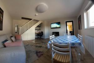 a living room with a table and a couch at PatsView Lodge in Donegal