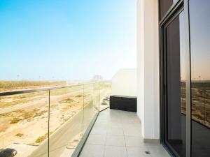 a balcony in a building with a view of a highway at Luxury 1-Bedroom Hideaway In Meydan in Dubai