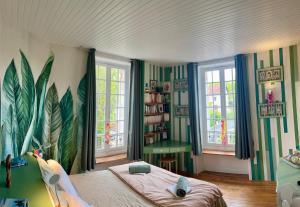 a bedroom with a bed and two windows at Villa AJNA Bayonne in Bayonne +139 photos