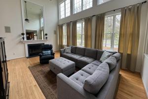 a living room with a couch and a chair at Bethany Lakes - 31292 May in Bethany Beach
