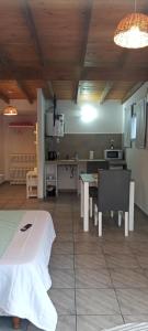 a kitchen and dining room with a table and a tableablish at ALOJAMIRAMAR in Miramar