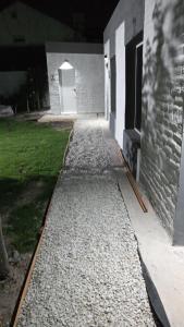 a walkway leading to a building with a door at ALOJAMIRAMAR in Miramar +1 photo