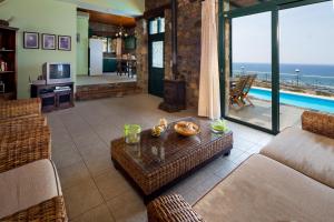 a living room with a view of the ocean at Amazing sea views at villa Elafonissi with private pool, near Elafonissi beach in Chania