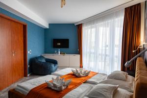 Postel nebo postele na pokoji v ubytování Hotel Atlantis Wellness & Conference