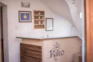a staircase in a house with a sign on the wall at Hotel Kiko in Bitola