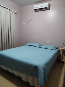 Postel nebo postele na pokoji v ubytování Casa de 2 Pavimentos Inteira com garagem