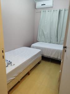 Postel nebo postele na pokoji v ubytování Casa de 2 Pavimentos Inteira com garagem