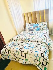 Ένα ή περισσότερα κρεβάτια σε δωμάτιο στο Miraph Apartment