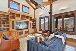 A seating area at Ski in out Mountain Estate in The Colony w Hot Tub, Theater, Game Room