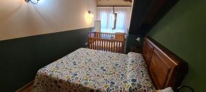 A bed or beds in a room at Apartamentos La Corona - Cabrales