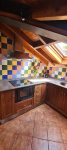 A kitchen or kitchenette at Apartamentos La Corona - Cabrales