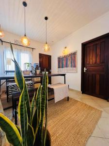 a living room with a table and a plant at Makini Spaces in Arusha