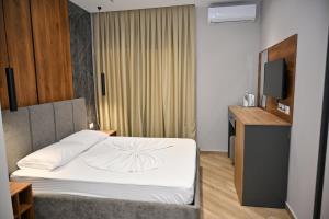 Postel nebo postele na pokoji v ubytování MondurO Hotel