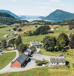 an aerial view of a farm with a house and a road at Guddals Tunet in Rosendal