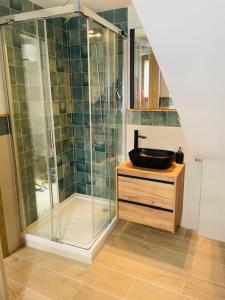 a bathroom with a glass shower and a sink at El Rincón de Victoria y Manolo in Sotillo de la Adrada +18 photos