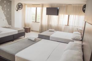 Voodi või voodid majutusasutuse HOTEl INTER DEL CAFE toas
