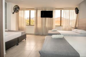 Postel nebo postele na pokoji v ubytování HOTEl INTER DEL CAFE