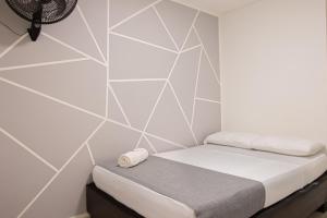 Voodi või voodid majutusasutuse HOTEl INTER DEL CAFE toas
