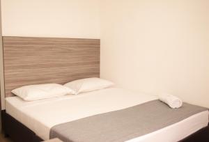 Voodi või voodid majutusasutuse HOTEl INTER DEL CAFE toas