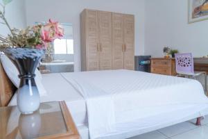 Postel nebo postele na pokoji v ubytování Hotel Azur Conakry