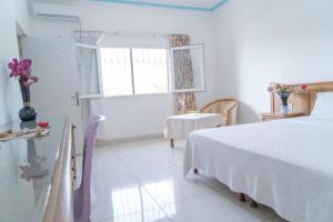 Postel nebo postele na pokoji v ubytování Hotel Azur Conakry